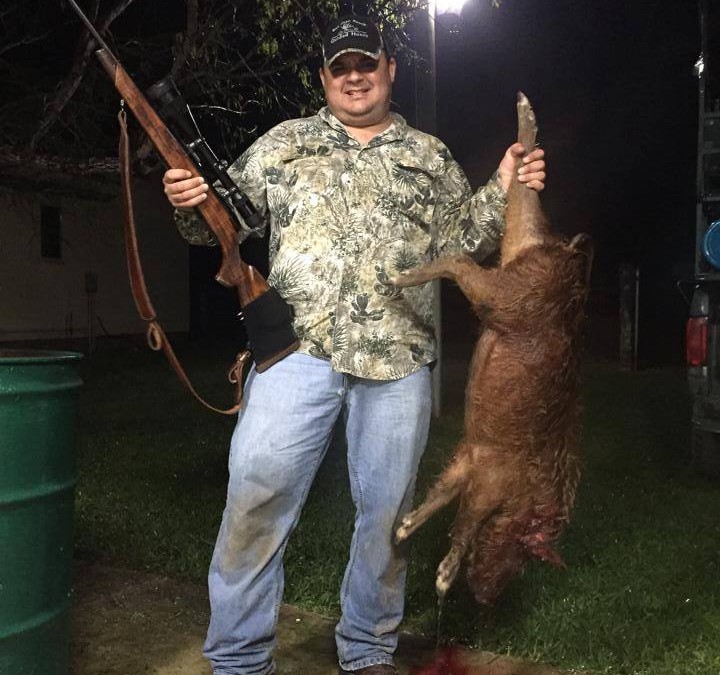 Orly Ochoa with his stalked hog