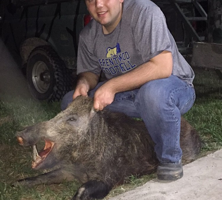 Carter McFarland proud with his Hog harvest